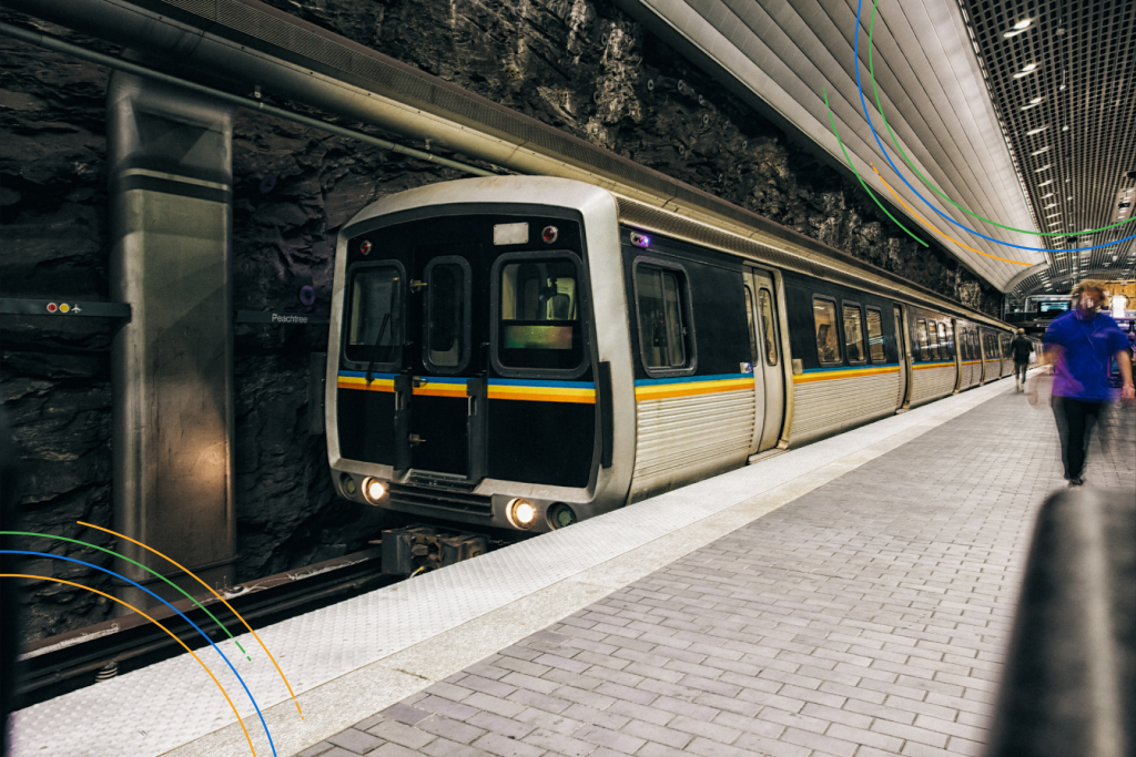 commuter trains pulling up to an underground platform