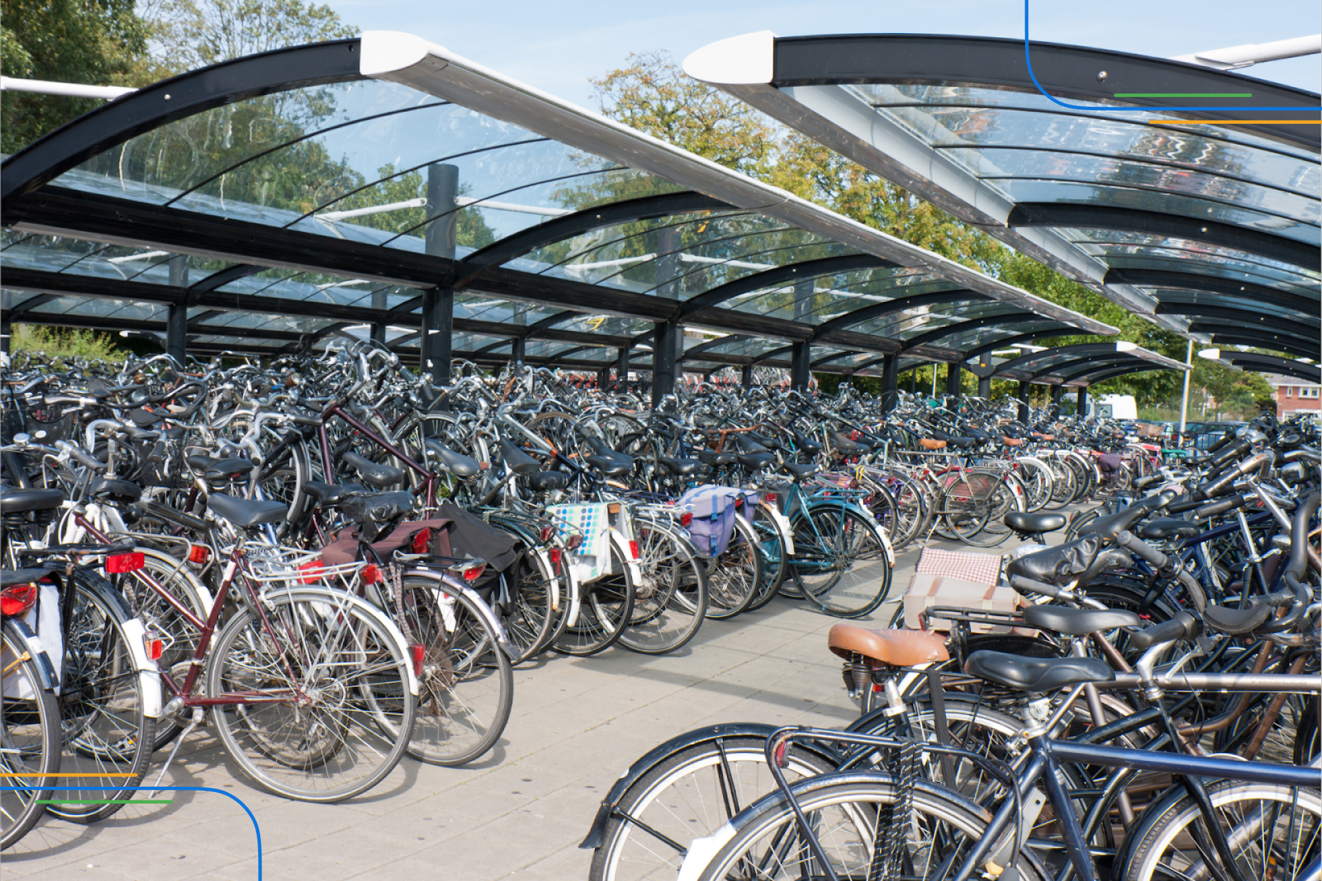 rows of Dutch bikes parked in a sunny bike parking facility