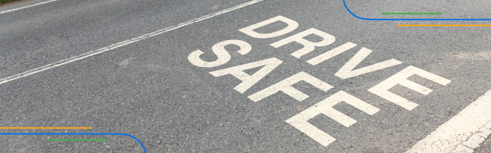 the message “drive safe” written on a road