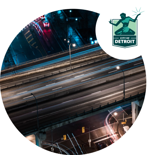 empty highway in circle image with Detroit logo on top right