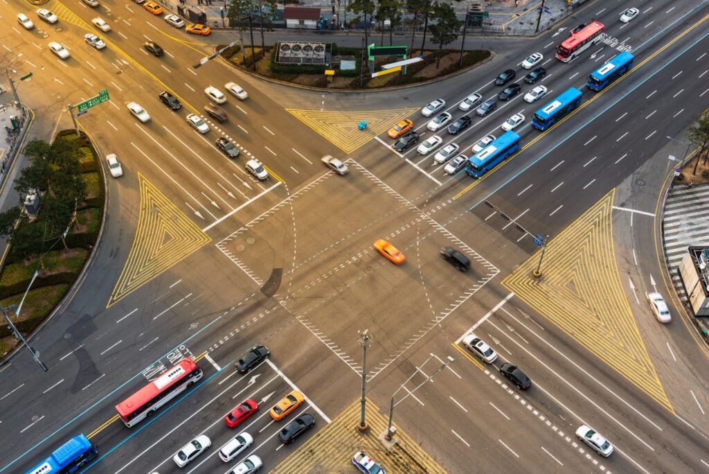 Rush-hour traffic zips through an intersection 