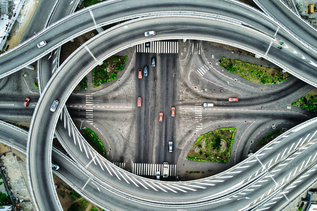 An aerial view of winding freeways in a city.