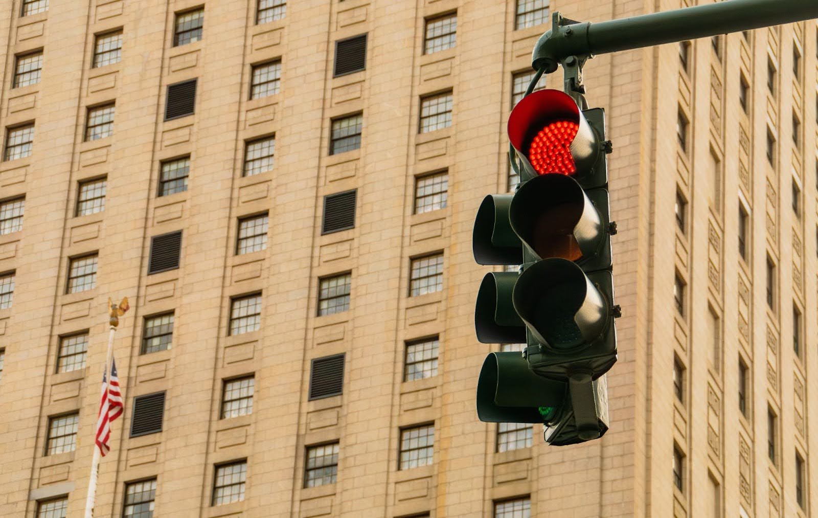 A modern three-signal traffic light in New York City.