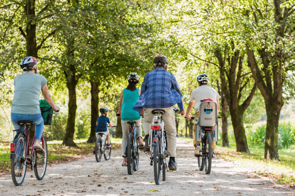 A family of cyclist on the road emphasizes pedestrian and cyclist safety.