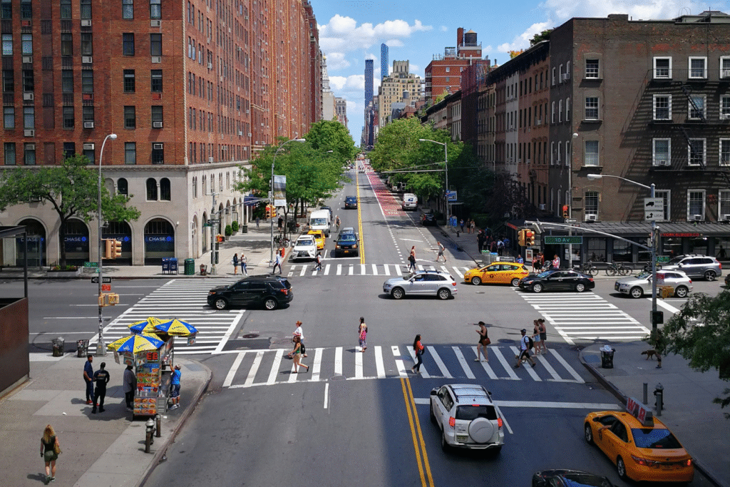 An intersection with vehicles and pedestrians crossing