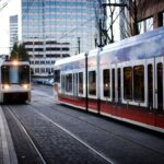 Streetcars in a downtown setting during the day.