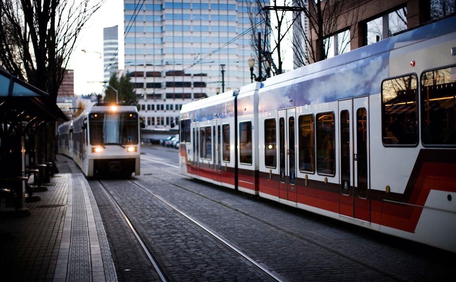 Streetcars in a downtown setting during the day.