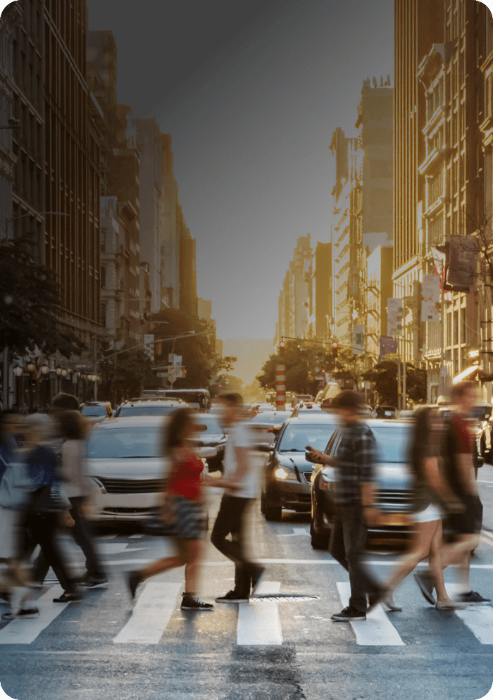 Pedestrians crossing in front of stopped traffic